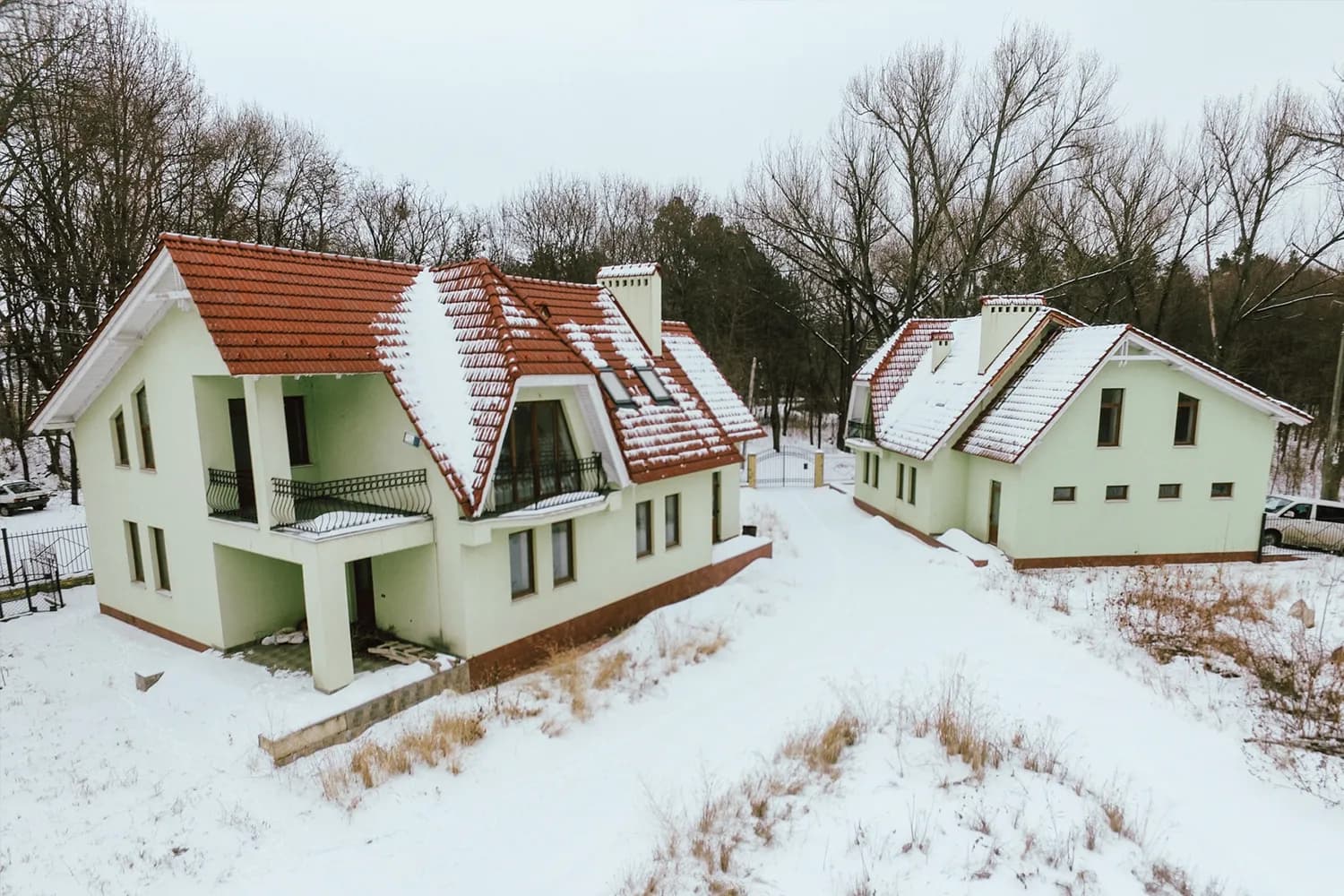 The family homes at Vatra Village under winter snow