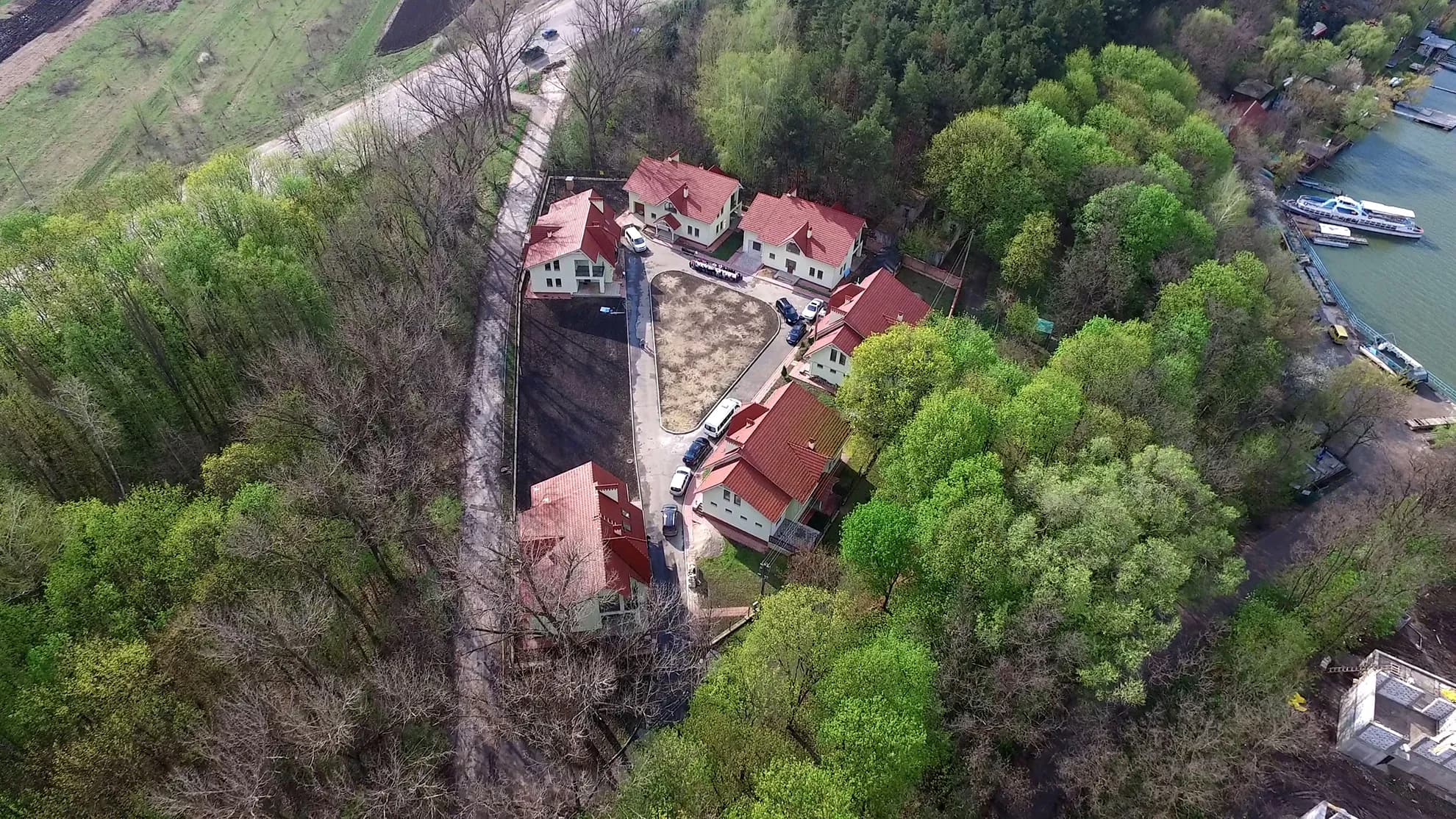 Aerial view of the Vatra Village family homes around the green